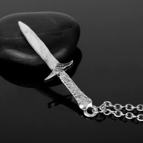 Sword pendant with glowing sword